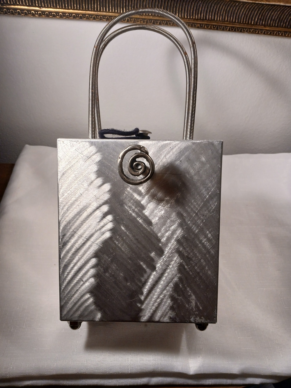Hand Crafted Silver Metallic Mini Bag with Spiral Accent